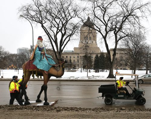 The last of the three wise men on journey down Osborne Street North Tuesday morning from the roof over the entrance of The Great-West Life Assurance Company office building to indoor storage until next Christmas season.   Wayne Glowacki/Winnipeg Free Press Jan. 20 2015