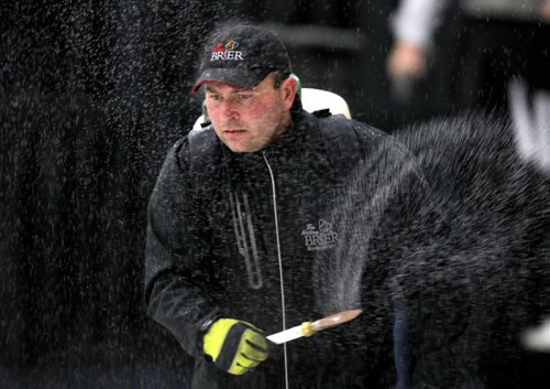 SPORTS CURLING - The Scottie Tournament of Hearts. Winkler, Manitoba. Practice. Head ice technician Greg Ewasko puts on the ice pebbles. BORIS MINKEVICH/WINNIPEG FREE PRESS. JANUARY 20, 2015