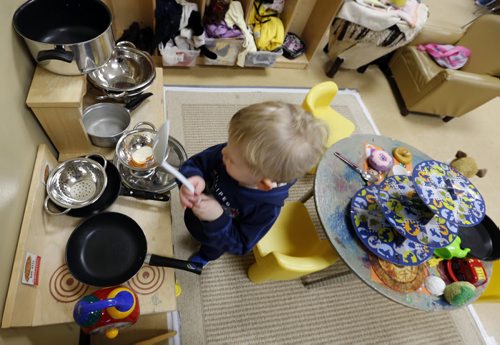 49.8 Daniel works in the play kitchen  in the  Sunny Mountain Day Care Centre. Mary Agnes Welch story. Wayne Glowacki/Winnipeg Free Press Jan. 21 2015