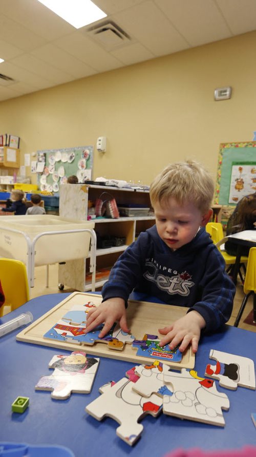 49.8 Daniel works on a puzzle  in the  Sunny Mountain Day Care Centre. Mary Agnes Welch story. Wayne Glowacki/Winnipeg Free Press Jan. 21 2015