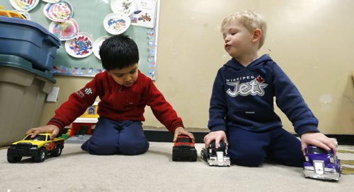 49.8 At left, Fateh with Daniel  in the  Sunny Mountain Day Care Centre. Mary Agnes Welch story. Wayne Glowacki/Winnipeg Free Press Jan. 21 2015