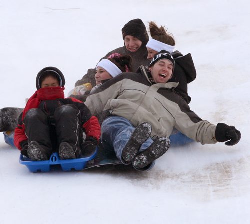 Ben Apperly , front-r, sails down Westview Park Wednesday afternoon with his family-Standup Photo- Jan 21, 2015   (JOE BRYKSA / WINNIPEG FREE PRESS)