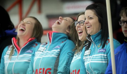 Kerri Einarson (far right) and her team to her right,  Selena Kaatz, Liz Fyfe and Kristin Maccuish, share some laughs during the opening ceremonies of the Scotties Curling Tournament at Winkler Arena Wednesday night.   Jan 21, 2015 Ruth Bonneville / Winnipeg Free Press