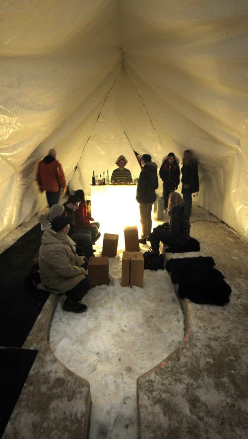 Patrons belly up to the bar Thursday evening as the "Raw Almond" opened its awning on the Junction of the Red and Assinaboine Rivers. See release. STAND-UP.  January 22, 2015 - (Phil Hossack / Winnipeg Free Press)