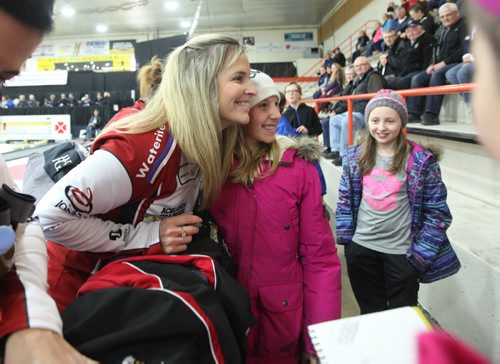 Olympic gold medalist  curler, Jennifer Jones has her picture taken with young curler, Rayna Krahn - 12yrs, as her friend, Hope Friesen (right) looks on, at the Winkler Arena  Friday after Jones and her team won their match against Robertson.  Jan 23, 2015 Ruth Bonneville / Winnipeg Free Press