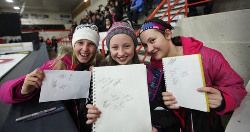 Sports, Curling. Young curler's (from left)  Rayna Krahn, Hope Friesen (centre) and Emily Kehler are all smiles as they show off their autographs they just got from the Jones team  at Winkler Arena  Friday at the Scotties Tournament of Hearts.  Jan 23, 2015 Ruth Bonneville / Winnipeg Free Press