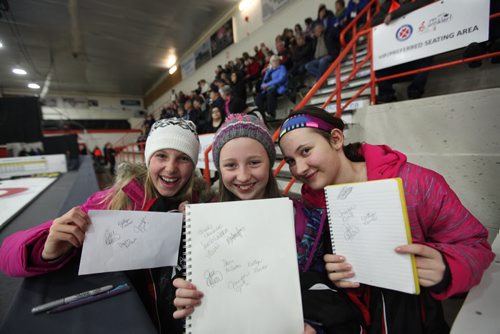 Sports, Curling. Young curler's (from left)  Rayna Krahn, Hope Friesen (centre) and Emily Kehler are all smiles as they show off their autographs they just got from the Jones team  at Winkler Arena  Friday at the Scotties Tournament of Hearts.  Jan 23, 2015 Ruth Bonneville / Winnipeg Free Press