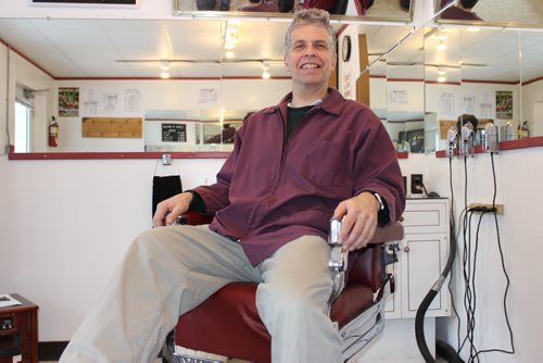 036 - Grant Hurrell, aka Hymie the Haircutter, of Neepawa, has a seat in the barber's chair. BILL REDEKOP/WINNIPEG FREE PRESS Jan 21, 2015