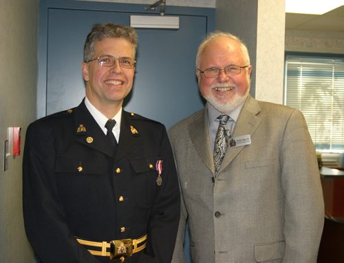 Grant Hurrell, aka Hymie the Haircutter, in uniform as RCMP auxiliary constable. PLEASE CREDIT NEEPAWA PRESS. Here he is in photo op for Conservative MP Bob Sopuck (Dauphin - Swan River - Marquette) accepting the Queen's Diamond Jubilee Award for community service, in 2012.
