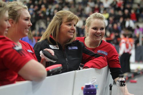 Sports, Curling. The Spencer team, Barb Spencer, second from right, Holly Spencer (right), Katie Spencer (left of Barb) and Aydney Arnal (not in photo) are all smiles after winning their game against Monfford 9 - 1 at Winkler Arena during the Scotties Tournament of Hearts Friday afternoon.   Jan 23, 2015 Ruth Bonneville / Winnipeg Free Press