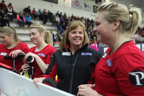 Sports, Curling. The Spencer team, Barb Spencer, second from right, Holly Spencer (right), Katie Spencer (left of Barb) and Aydney Arnal (far left) are all smiles after winning their game against Monfford 9 - 1 at Winkler Arena during the Scotties Tournament of Hearts Friday afternoon.   Jan 23, 2015 Ruth Bonneville / Winnipeg Free Press