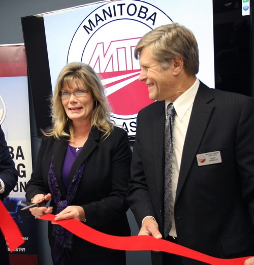 Shelly Glover- Minister of Canadian Heritage and Official Languages, left, and Gary Arnold of the Manitoba Trucking Association (MTA) at news conference to announce a $268,000 in funding to provide Western Canadian truck drivers and managers with skills training and technology demonstrations -See Mia Rabson story- Jan 23, 2015   (JOE BRYKSA / WINNIPEG FREE PRESS)
