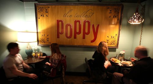 The sign that used to grace the outside of their former Main street location now hangs proudly inside the Sherbrook Inn location of the Tallest Poppy. See Dave Sanderson story. January 23, 2015 - (Phil Hossack / Winnipeg Free Press)