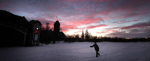 Red Sky at Night, Skier's delight....A cross country skier makes his way across the meadow behind the Pavilion at Assinaboine Park Friday evening with a beautiful sunset lighting his way. January 23, 2015 - (Phil Hossack / Winnipeg Free Press)