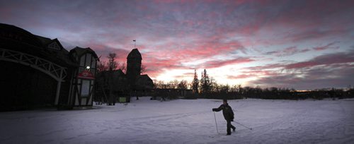 Red Sky at Night, Skier's delight....A cross country skier makes his way across the meadow behind the Pavilion at Assinaboine Park Friday evening with a beautiful sunset lighting his way. January 23, 2015 - (Phil Hossack / Winnipeg Free Press)