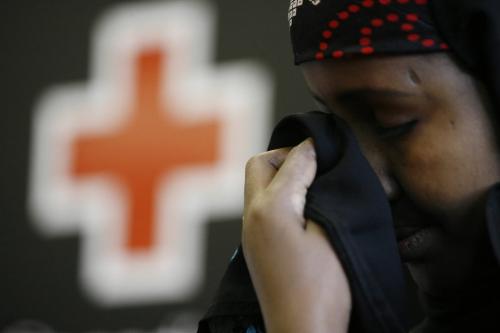 John Woods / Winnipeg Free Press / September 17/07- 070917  -  Ayaan Ahmed Jama, a Somalian refugee, wipes her eyes during a press conference at the Canadian Red Cross in Winnipeg Monday, September 17/07.      Ayaan has found out that her mother survived the conflict in Somalia.