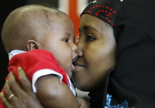 John Woods / Winnipeg Free Press / September 17/07- 070917  -  Ayaan Ahmed Jama, a Somalian refugee, cuddles her baby son Abdikani during a press conference at the Canadian Red Cross in Winnipeg Monday, September 17/07.      Ayaan has found out that her mother survived the conflict in Somalia.