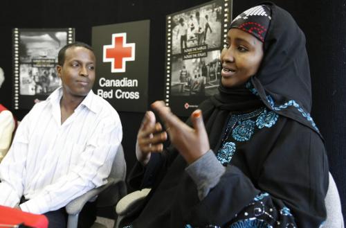 John Woods / Winnipeg Free Press / September 17/07- 070917  -  Ayaan Ahmed Jama, a Somalian refugee, with the assistance of translator Mustafa Ibrahim, tells her story during a press conference at the Canadian Red Cross in Winnipeg Monday, September 17/07.      Ayaan has found out that her mother survived the conflict in Somalia.