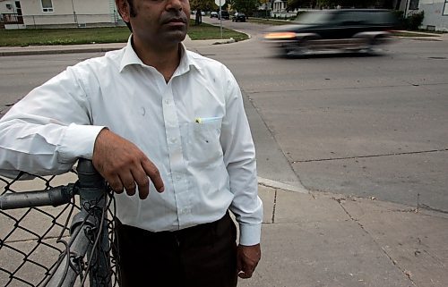 BORIS MINKEVICH / WINNIPEG FREE PRESS  070917 Salman Zaki shows where the he was abducted at gun point. Arlington and Flora. He experssed that he would not want to have his face shown in case the thugs might cause him problems later.
