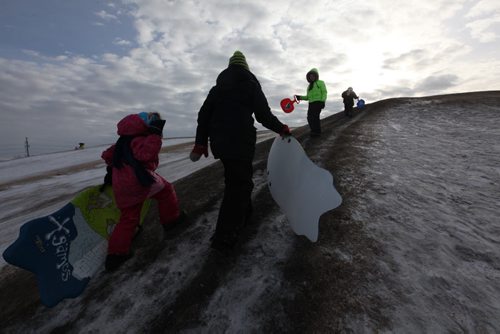 Story on Tobogganing. Angela Leblanc (From bottom of hill) , Michelle Looker, Skyla Riaux-Lowry and Brieanna Looker make their way up Garbage Hill to toboggan Saturday afternoon.  See Bill Redekop's story. Jan 24, 2015 Ruth Bonneville / Winnipeg Free Press