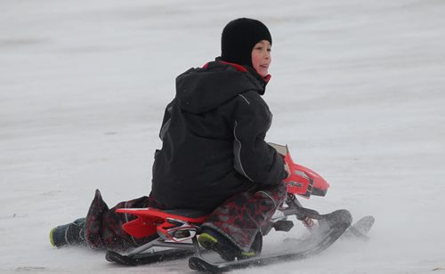 Story on Tobogganing. Nine year old Kai Lim does a 360 with his sled after coming down Garbage Hill  Saturday afternoon.  See Bill Redekop's story. Jan 24, 2015 Ruth Bonneville / Winnipeg Free Press