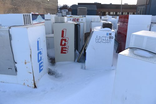DAVID LIPNOWSKI / WINNIPEG FREE PRESS (January 24, 2015)  Retired ice machines sit in the snow behind the Arctic Glacier Ice building Saturday afternoon.