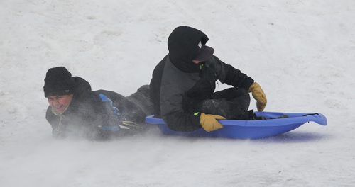 Story on Tobogganing. Pierre Stevenson (left) and Mason Johnson laugh while  making their way down Garbage Hill  Saturday afternoon.  See Bill Redekop's story. Jan 24, 2015 Ruth Bonneville / Winnipeg Free Press