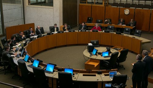 Bob Silver (far right), chair of RBC Convention Centre, presents at a special EPC meeting with council Roger King regarding the convention centre hotel deal. January 26, 2015 (Melissa Tait / Winnipeg Free Press)