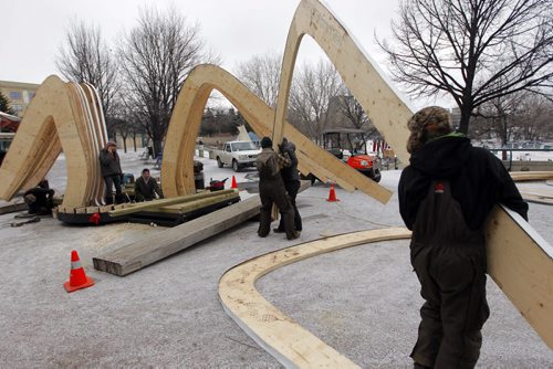 LOCAL - The Forks Warming Huts-Workers construct hut in the by Invitation category: The Hybrid Hut. By Mexico City firm Rojkind Arquitectos. The hut will be made of wood arches covered in leaves of recycled timber. BORIS MINKEVICH / WINNIPEG FREE PRESS  Jan. 26, 2015