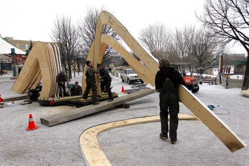 LOCAL - The Forks Warming Huts-Workers construct hut in the by Invitation category: The Hybrid Hut. By Mexico City firm Rojkind Arquitectos. The hut will be made of wood arches covered in leaves of recycled timber. BORIS MINKEVICH / WINNIPEG FREE PRESS  Jan. 26, 2015