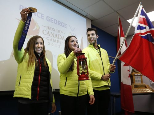 For the up coming 2015 Canada Winter Games in Prince George, B.C., Team Manitoba announced from left,  Kaitlyn Lawes as their  Honourary Captain, Christian Higham as lantern bearer beside Keenan Brown the flag bearer.  They are wearing the team's new flashy attire. Melissa Martin story Wayne Glowacki/Winnipeg Free Press Jan. 27 2015