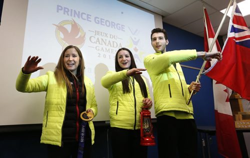 For the up coming 2015 Canada Winter Games in Prince George, B.C., Team Manitoba announced from left, Kaitlyn Lawes as their  Honourary Captain, Christian Higham as  lantern bearer beside Keenan Brown as flag bearer.  They are doing the Manitoba Cheer wearing the team's new flashy attire. Melissa Martin story Wayne Glowacki/Winnipeg Free Press Jan. 27 2015