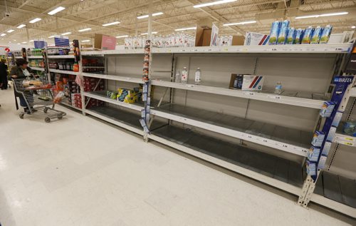 January 27, 2015 - 150127  -  With a run on bottled water earlier in the day late night shoppers were were greeted with empty shelves after Winnipeg authorities issued a boil water advisory after a e.coli positive test Tuesday, January 27, 2015.  John Woods / Winnipeg Free Press
