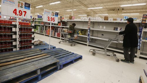 January 27, 2015 - 150127  -  With a run on bottled water earlier in the day late night shoppers were were greeted with empty shelves and pallets after Winnipeg authorities issued a boil water advisory after a e.coli positive test Tuesday, January 27, 2015.  John Woods / Winnipeg Free Press