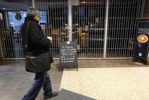 A sign outside the Starbucks in the Radisson Hotel indicates it is closed because of the water advisory.   150128 January 28, 2015 Mike Deal / Winnipeg Free Press