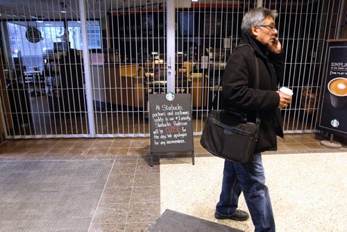 A sign outside the Starbucks in the Radisson Hotel indicates it is closed because of the water advisory.   150128 January 28, 2015 Mike Deal / Winnipeg Free Press