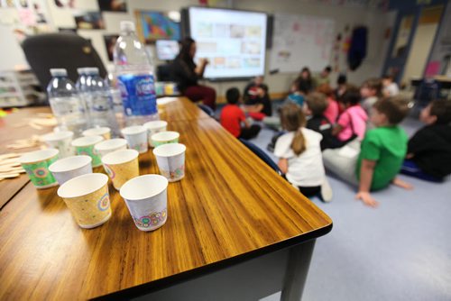 Victory School students grade 2/3 class have a water station set up on a school desk with dixie cups and water bottles Wednesday afternoon due to the boil water advisory by the City of Wpg.  See story.   Jan 28, 2015 Ruth Bonneville / Winnipeg Free Press