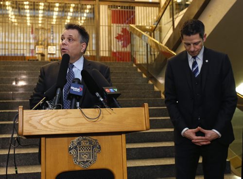 Geoff Patton, Manager for Engineering, Water and Waste Dept. at the podium with Winnipeg Mayor Brian Bowman at a news conference at City Hall Wednesday to announce a citywide precautionary boil-water advisory remains in effect until the Province of Manitoba declares Winnipeg's water is safe to drink. Aldo Santin/Bart Kives stories  Wayne Glowacki/Winnipeg Free Press Jan. 28 2015