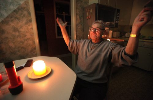 Auschwitz survivor Morris Faintuch sits in his kitchen lit by candlelight as he gives an interview about his experience at the Nazi death camp. See Randy Turner story. January 28, 2015 - (Phil Hossack / Winnipeg Free Press)