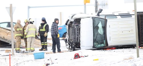 Springfield fire services and emergency workers around the upended truck involved in a collision at Dugald Road and the Perimeter Hwy Friday morning. Apparently there was more than one vehicle involved this was the one remaining at 1030. January 30, 2015 - (Phil Hossack / Winnipeg Free Press)