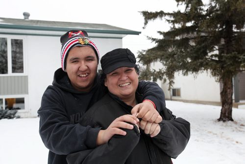 Shelly Peebles and her sixteen year old son Dylan are proud new home owners as they move into their  own home with assistance from the Manitoba Real Estate Association and Manitoba Tipi Mitawa Friday.  See Mary Agnes story.  Jan 30, 2015 Ruth Bonneville / Winnipeg Free Press