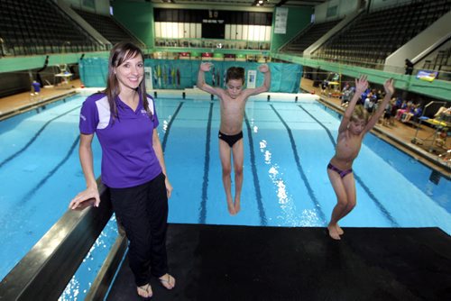 SPORTS - DIVING - Dallas Ludwick, head coach of Revolution Diving. The boys diving are (L) Adam Cohen and (R) Eric Bisson, both 9. BORIS MINKEVICH / WINNIPEG FREE PRESS  Jan. 30, 2015
