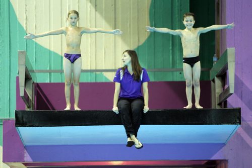 SPORTS - DIVING - (sitting) Dallas Ludwick, head coach of Revolution Diving. The boys diving are (R) Adam Cohen and (L) Eric Bisson, both 9. BORIS MINKEVICH / WINNIPEG FREE PRESS  Jan. 30, 2015