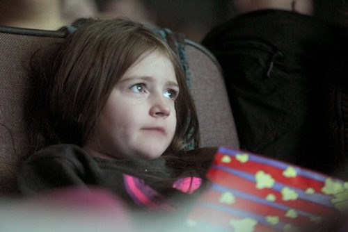 Seven-year-old Ava Swan is glued to the large screen at Cinematheque Theatre as she watches retro cartoons with her  cousin Saturday.   The theatre ran 3 hours of cartoons from the 60's through the 80's complete with sugary cereals, milk and popcorn.    Standup photo  Jan 31, 2015 Ruth Bonneville / Winnipeg Free Press