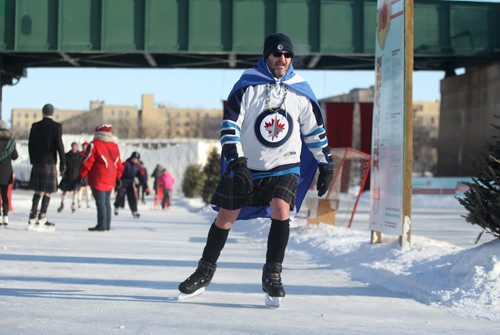 Mike Boyle braves the bitter cold and high wind chills to take part in the nation-wide Kilt Skate put on by the Scottish Society of Ottawa honoring the 200th anniversary of Sir John A McDonald's life at The Forks Saturday.  Hot chocolate, birthday cake and a  birthday card for Macdonald will be on hand for people to sign. Standup photo  Jan 31, 2015 Ruth Bonneville / Winnipeg Free Press
