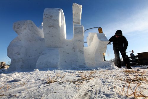Artist  Matthieu Bohémier works on a snow sculpture for the Festival du Voyageur on Marion at St. Mary's Ave. Saturday afternoon.  Standup photo  Jan 31, 2015 Ruth Bonneville / Winnipeg Free Press
