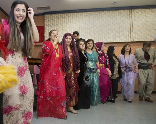 Rujan Matin (far left) dances along with the Kurdish Association of Manitoba to celebrate winning back the city of Kobane from the Islamic State on Saturday night at the Eagles Club. Sarah Taylor / Winnipeg Free Press January 31, 2015