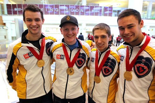 SPORTS - CURLING - Team Manitoba, Canadian champs arrive home, from left, lead Brendan Wilson, skip Braden Calvert, second Lucas Van Den Bosch and third Kyle Kurz. They pose for a photo at the the airport. BORIS MINKEVICH / WINNIPEG FREE PRESS  FEB 2, 2015