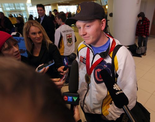 SPORTS - CURLING - Team Manitoba, Canadian champs arrive home. Skip Braden Calvert talks to the media at the the airport. BORIS MINKEVICH / WINNIPEG FREE PRESS  FEB 2, 2015