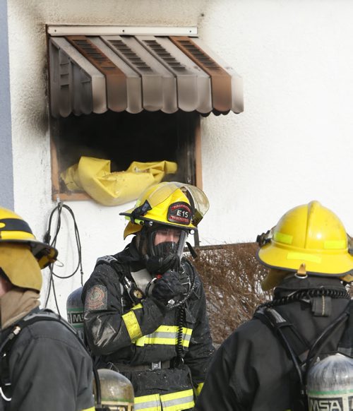 Winnipeg Fire Fighters responded to a call of smoke and fire coming from the bungalow at 48 Argonne Bay Monday morning. No one was home at the time they arrived, the cause of the fire that started in the kitchen in under investigation. Wayne Glowacki/Winnipeg Free Press Feb.2 2015